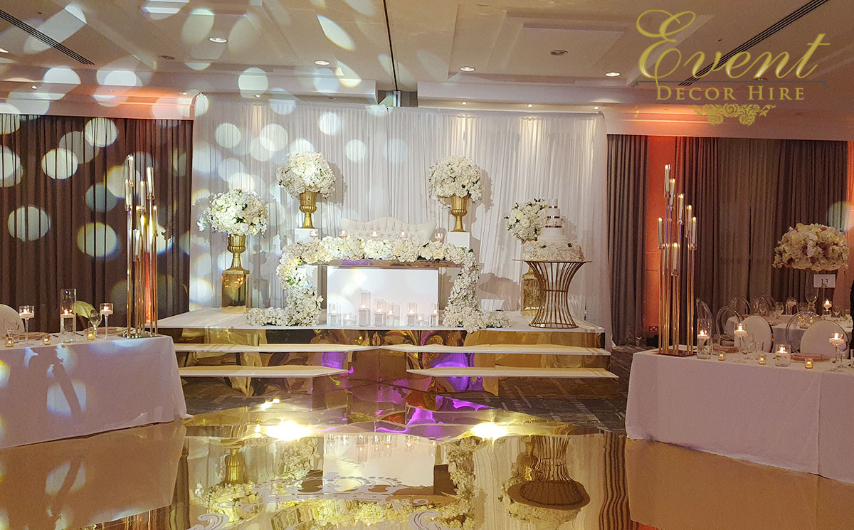 gold backdrop stage wedding